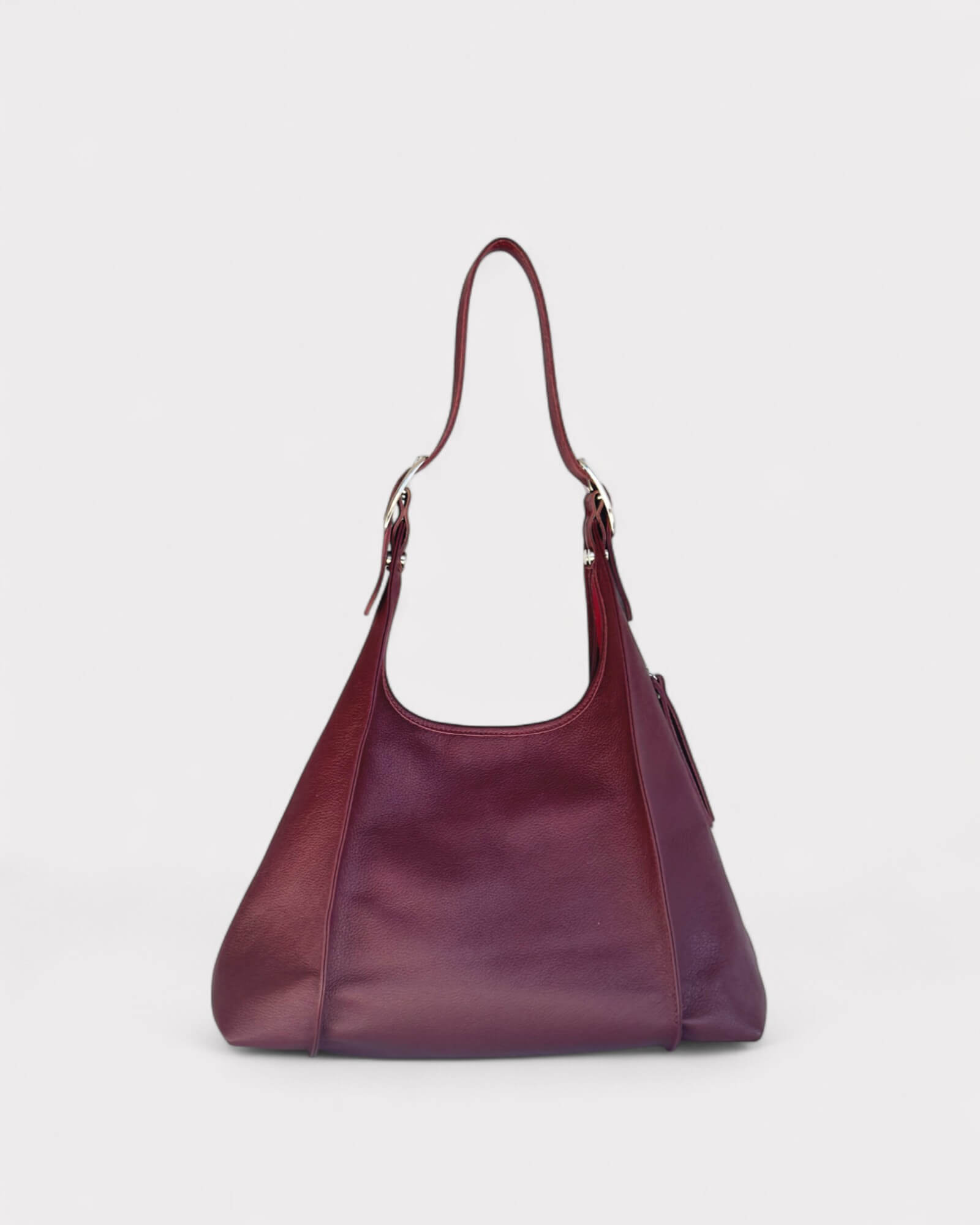 Burgundy handbag on a light gray background