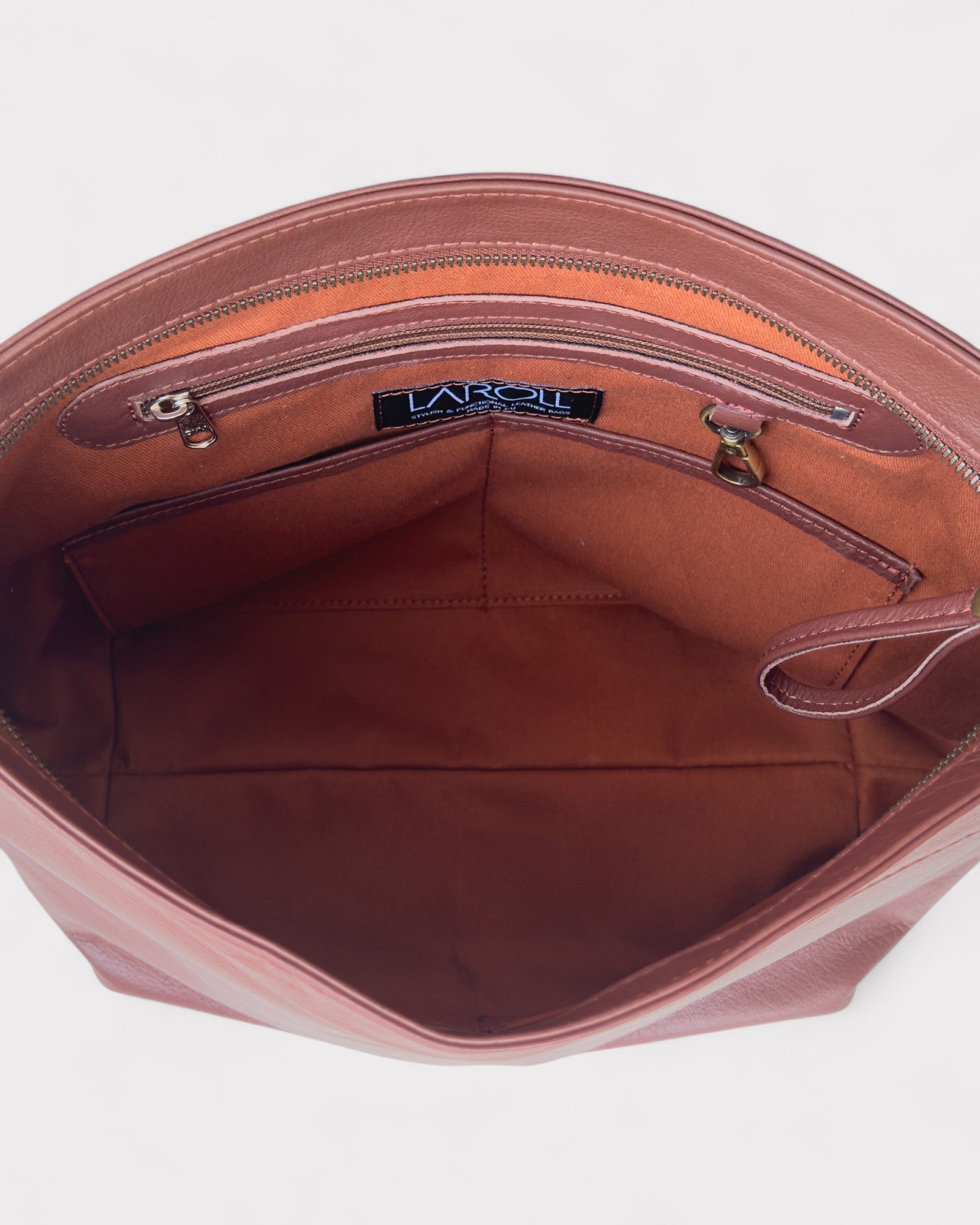 Open brown handbag with visible brand logo on a white background