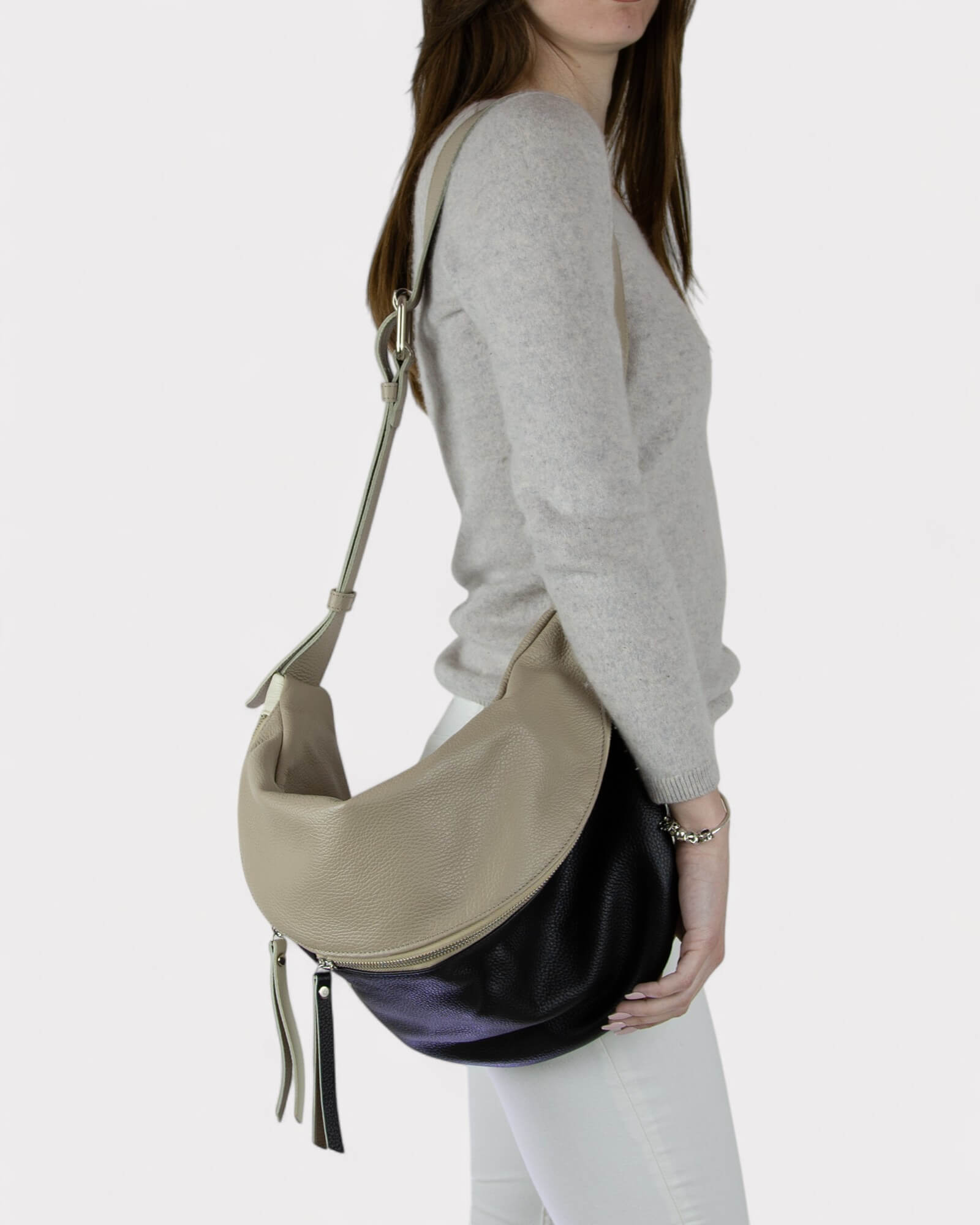 Woman wearing a two-tone black and white belt bag