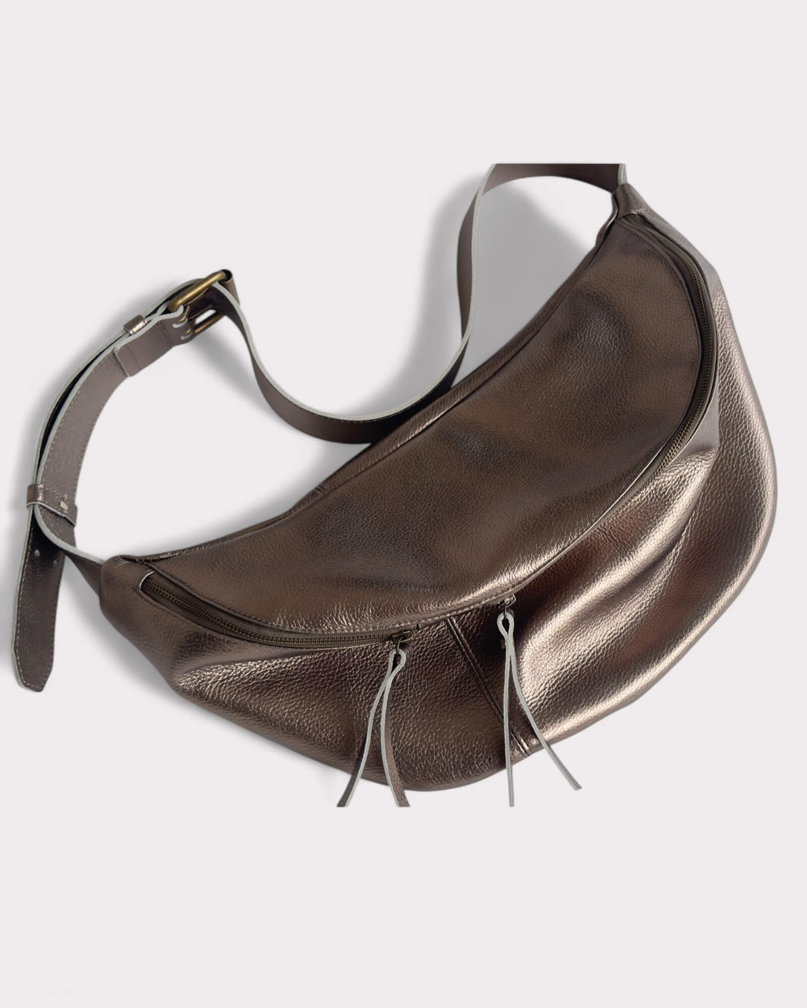 metallic bronze leather fanny pack on a light gray background