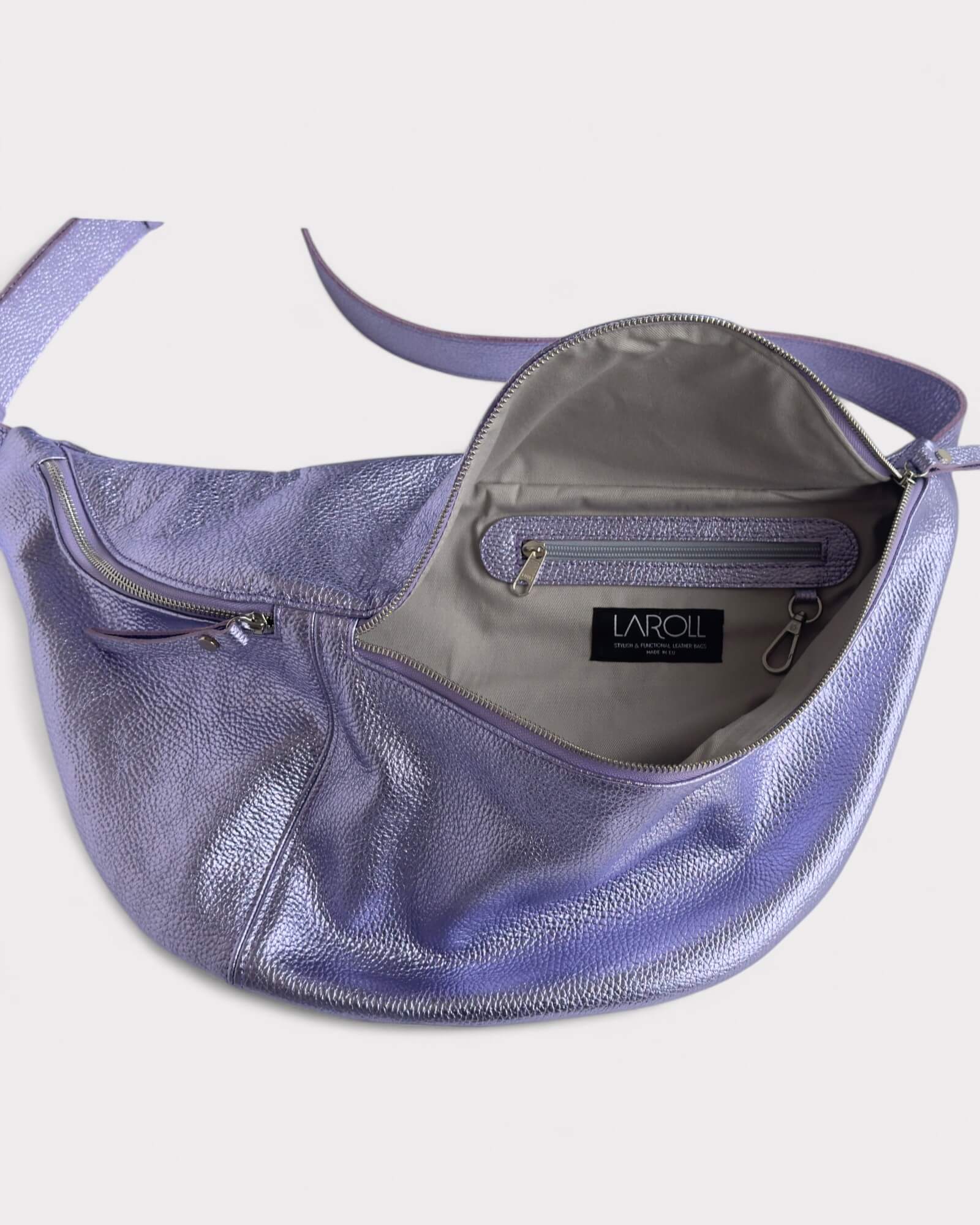 Purple handbag lining image with visible brand logo on a light gray background