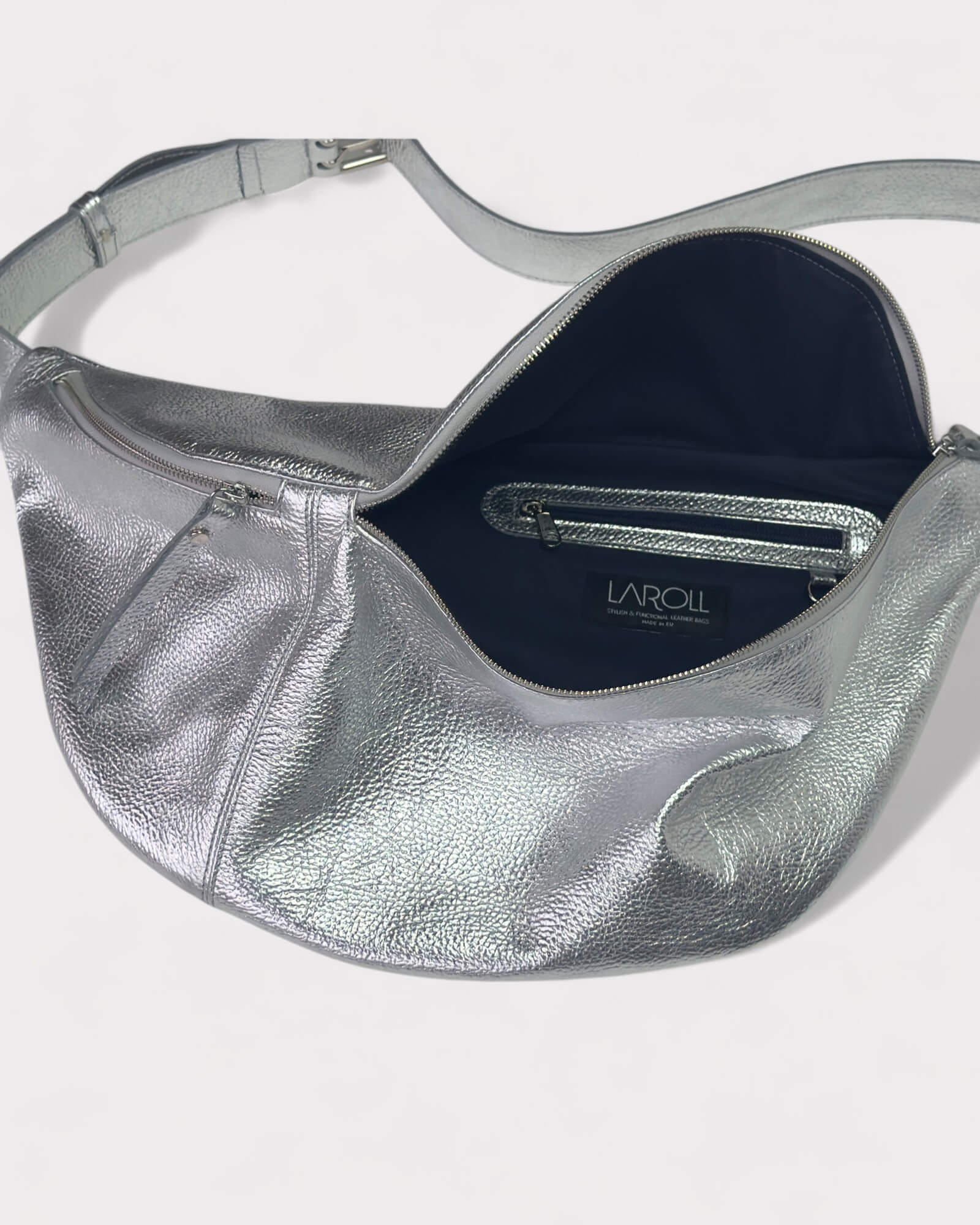 Silver metallic handbag lining image with visible brand name on a white background