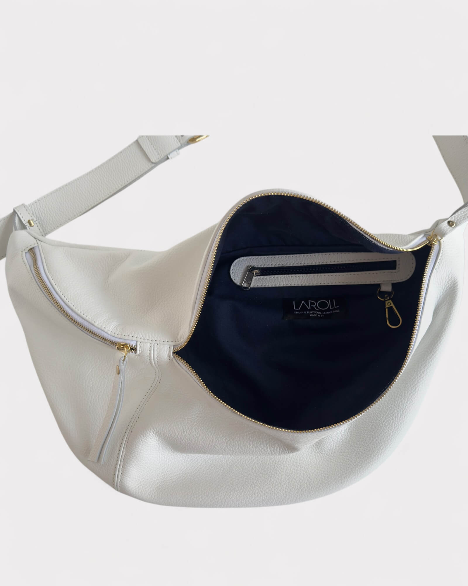 White handbag lining with a visible brand logo on a light gray background