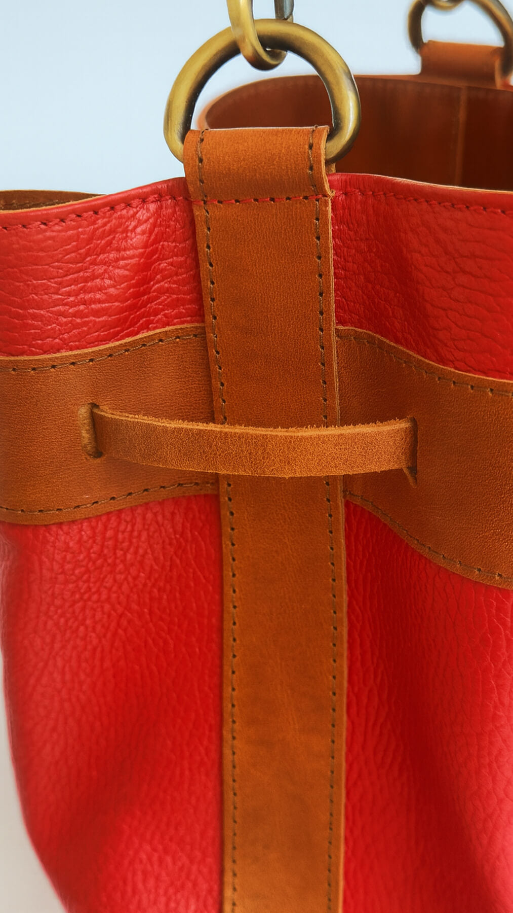 detail image of the red bucket bag