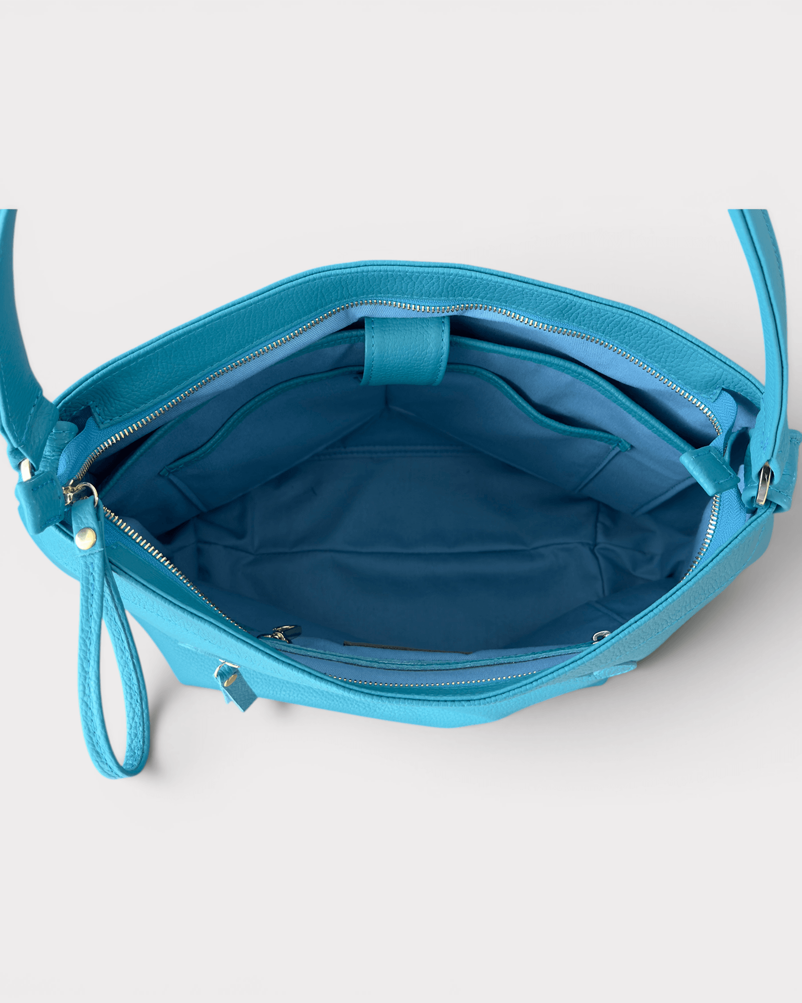 interior compartment of turquoise handbag