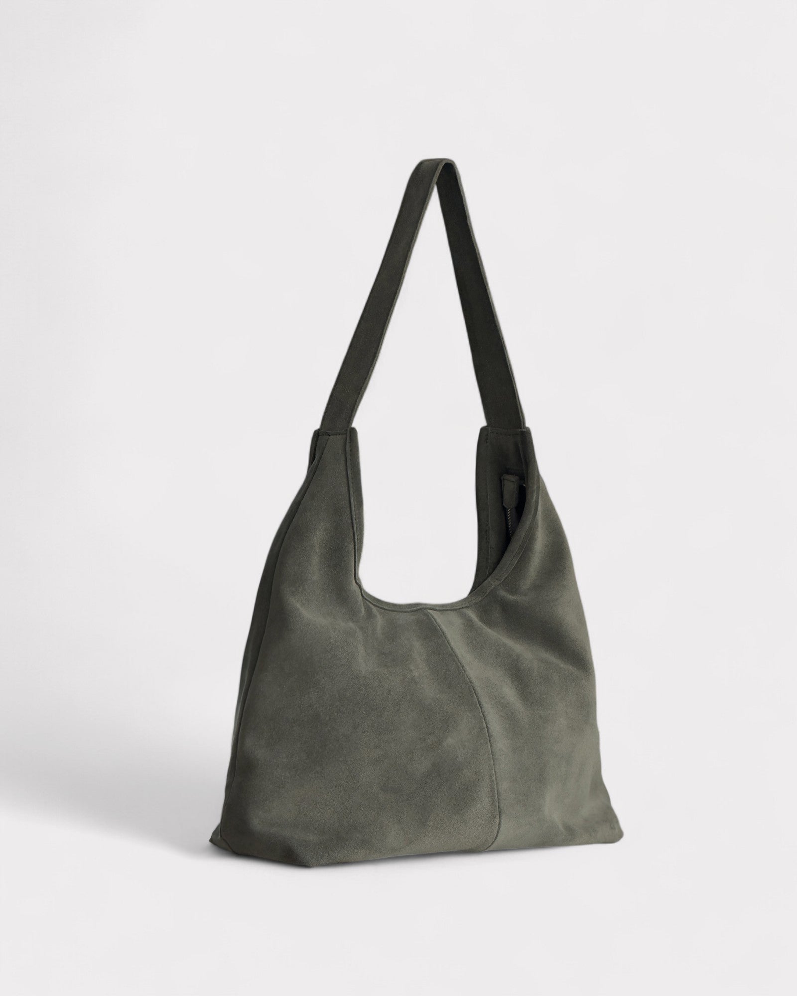Green handbag on a light gray background