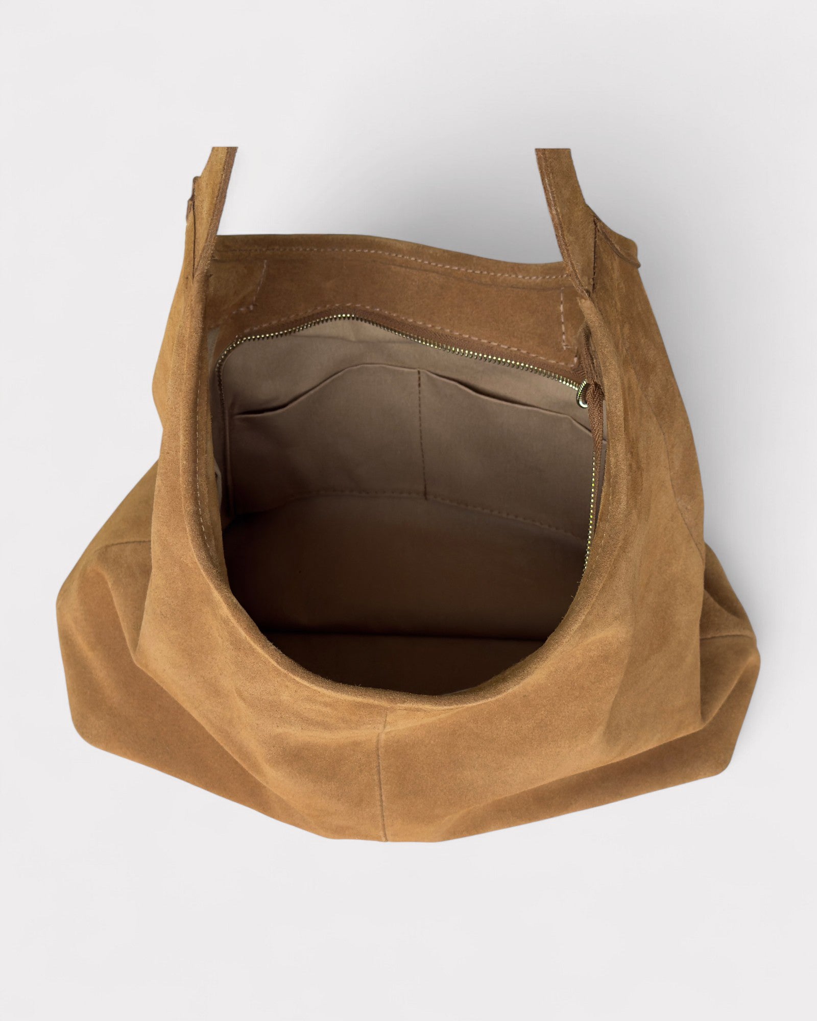 Tan leather bag on a white background