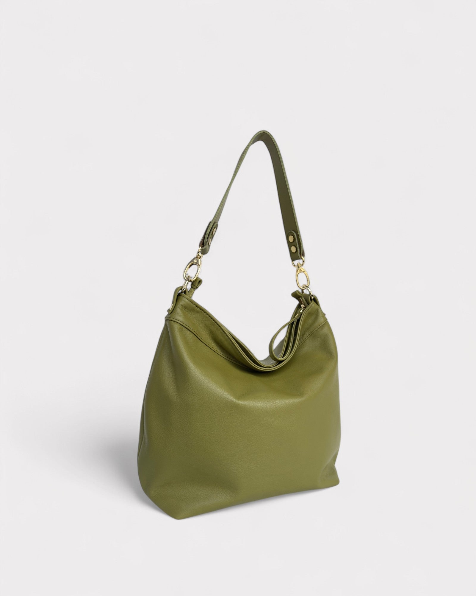 Green handbag on a light gray background
