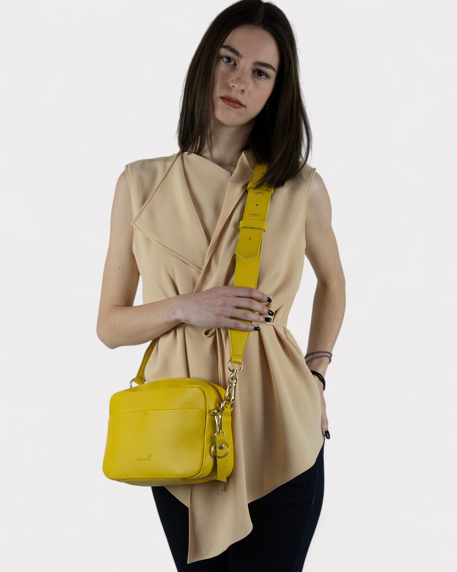 woman wearing yellow camera bag