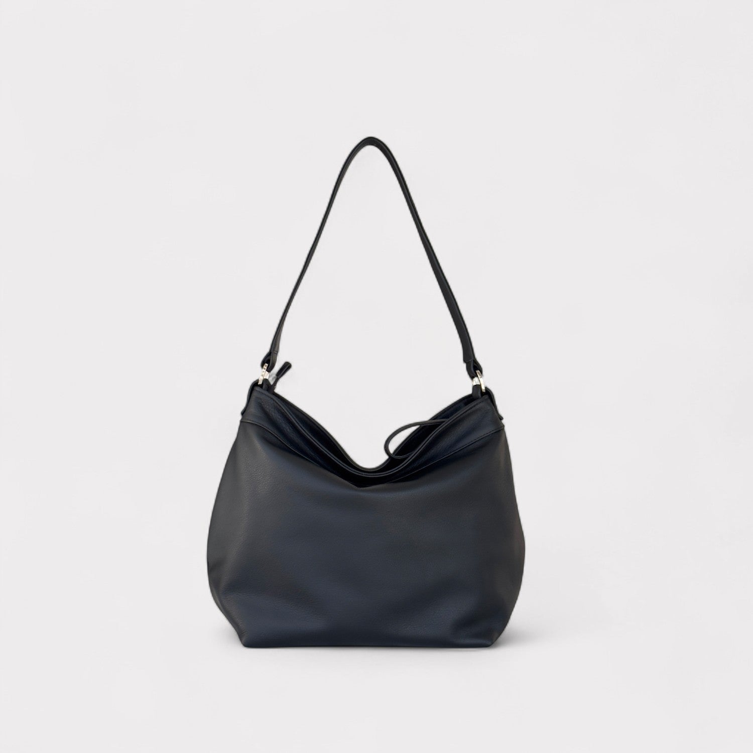 Black handbag on a light gray background