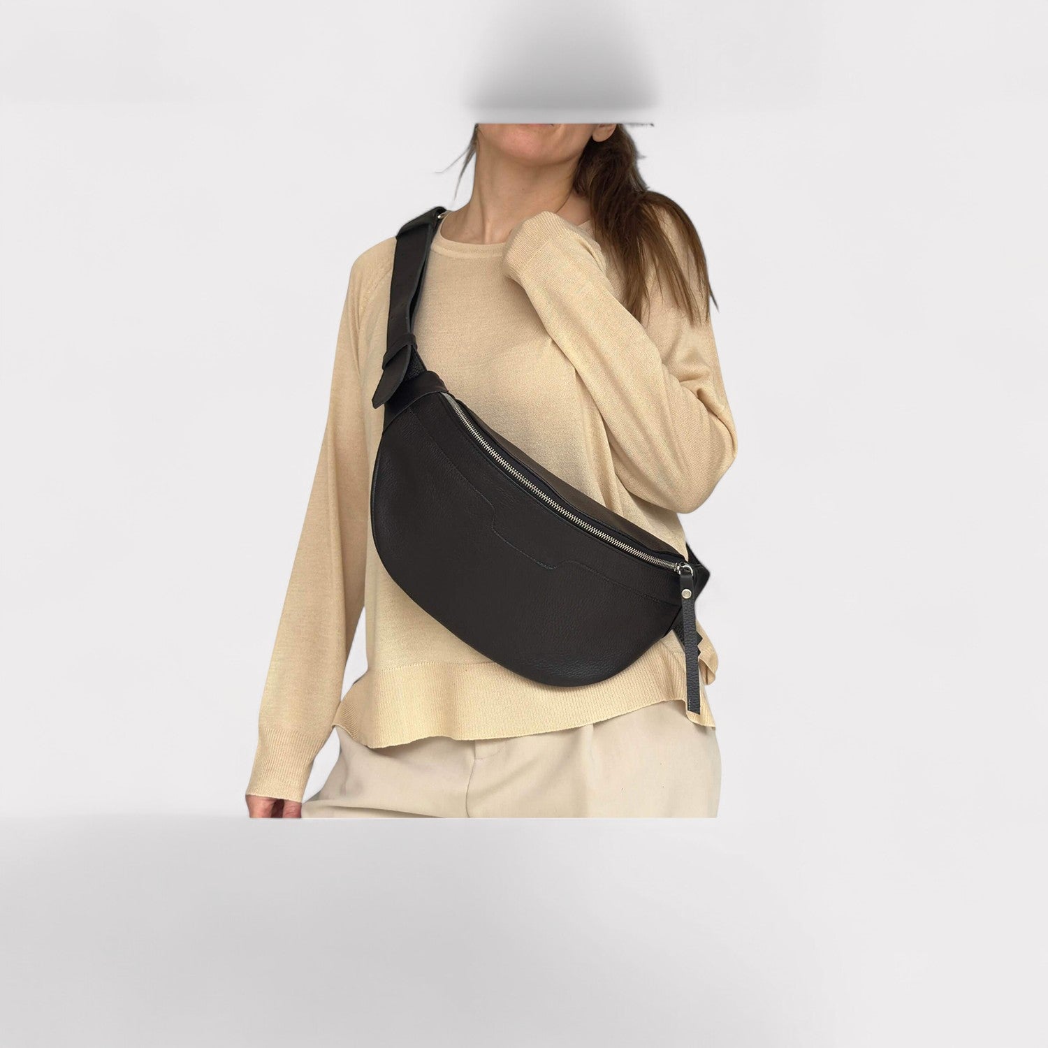 model wearing black medium fanny pack