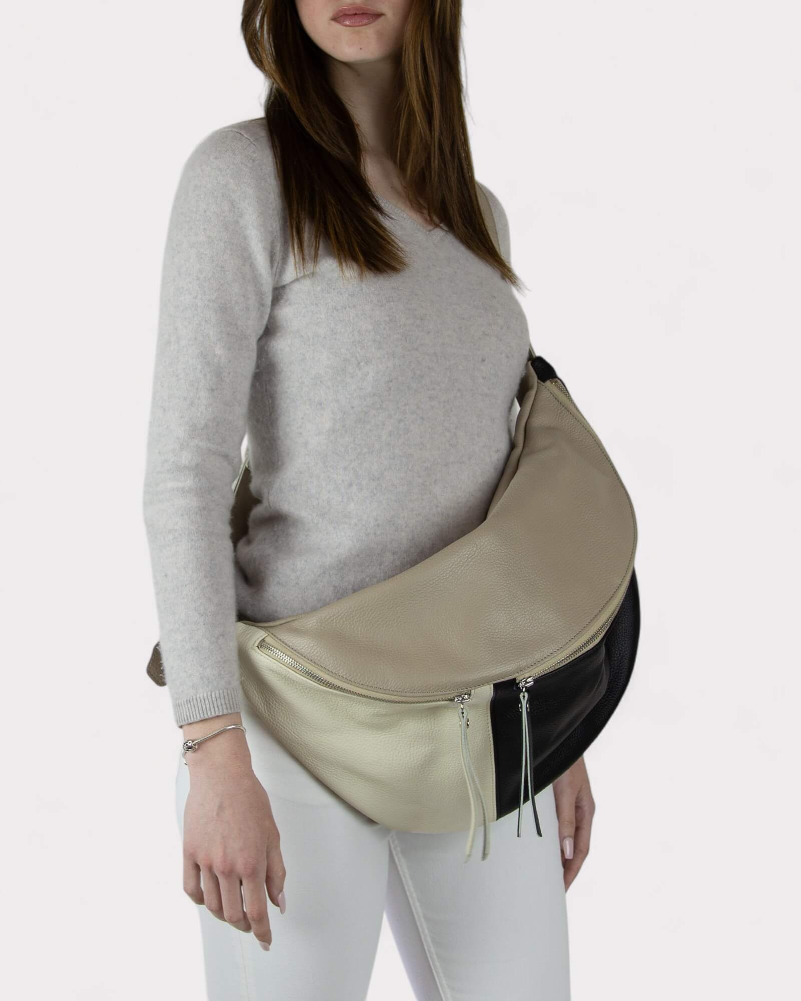 Woman wearing a two-tone black and white chest bag