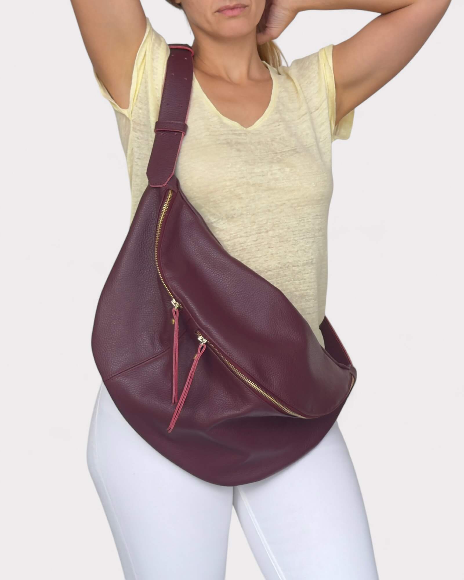 Woman wearing a burgundy leather bag 
