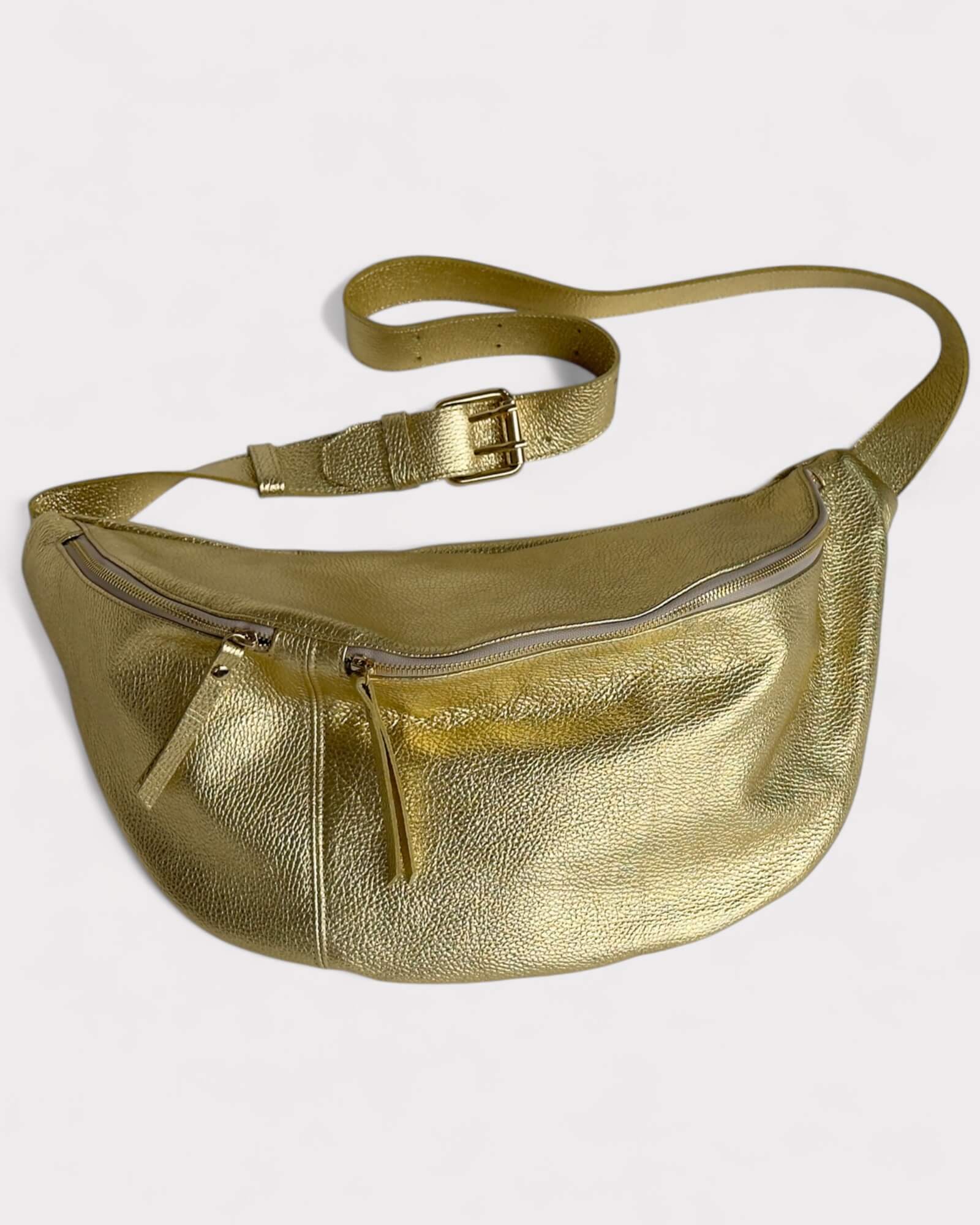 Gold metallic fanny pack on a light gray background