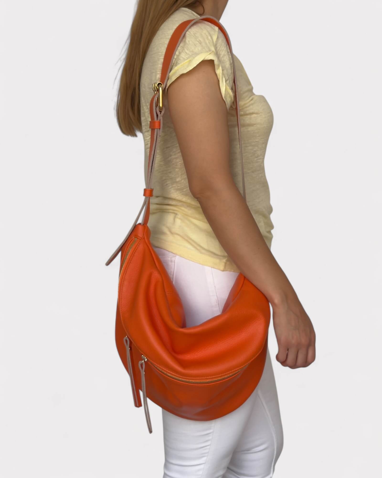 Person wearing  an orange belt bag on a white background