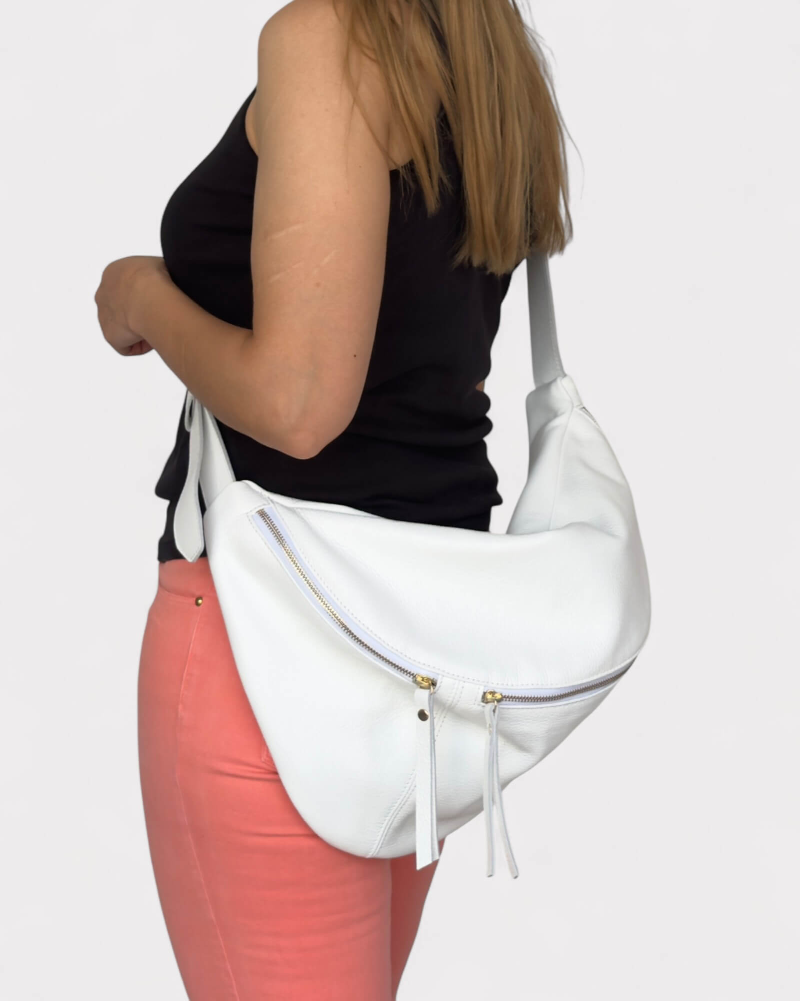 Model wearing  a fanny pack on a light gray background