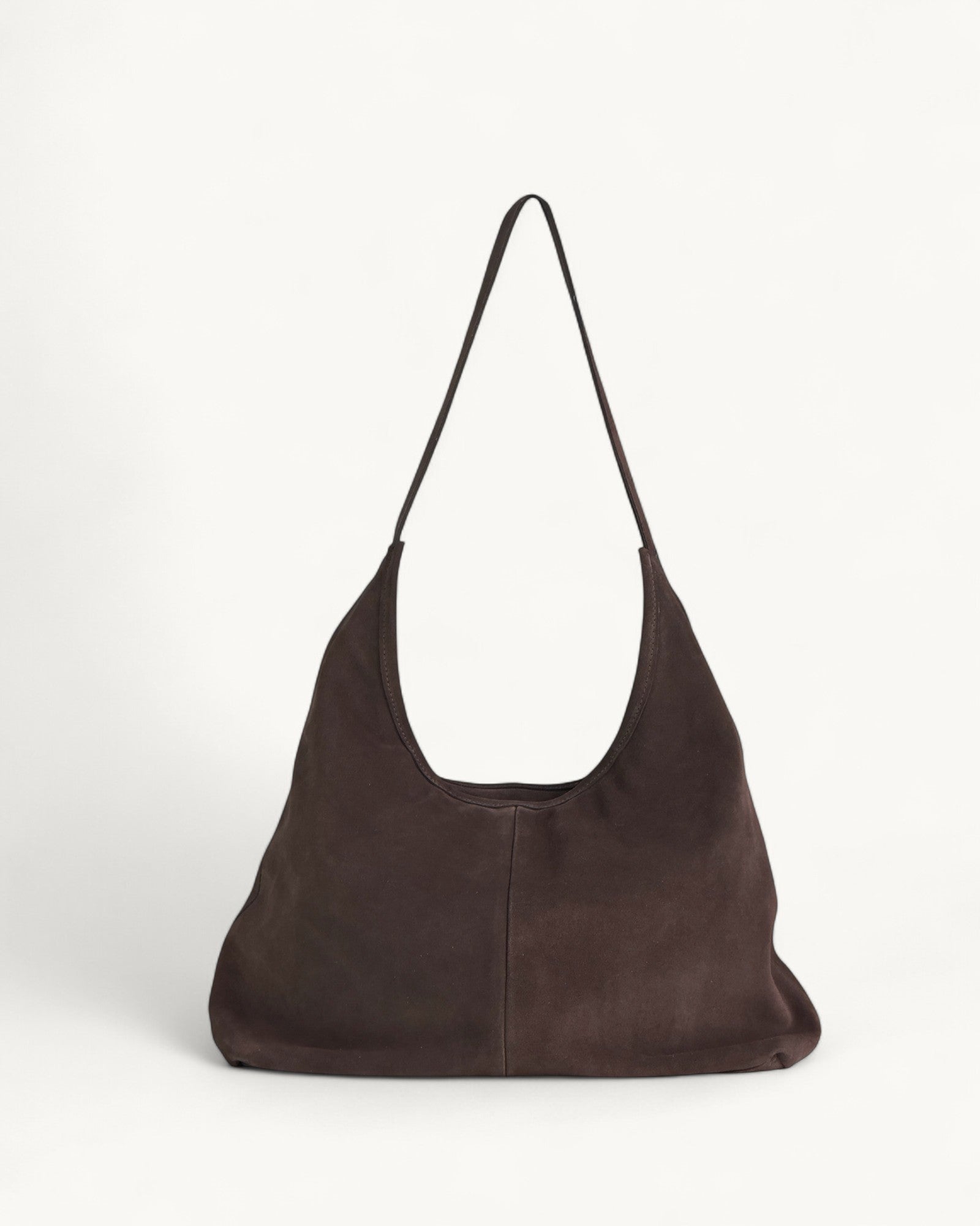 Brown leather handbag on a white background