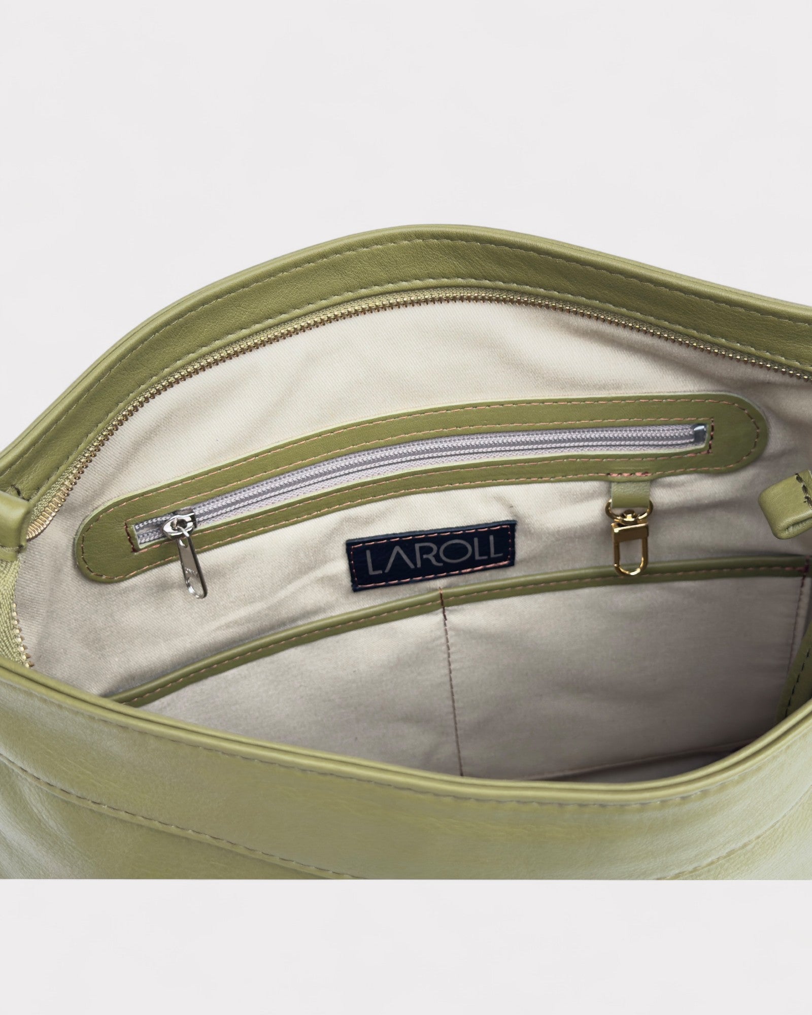 Green bag with a visible brand label on a light gray background