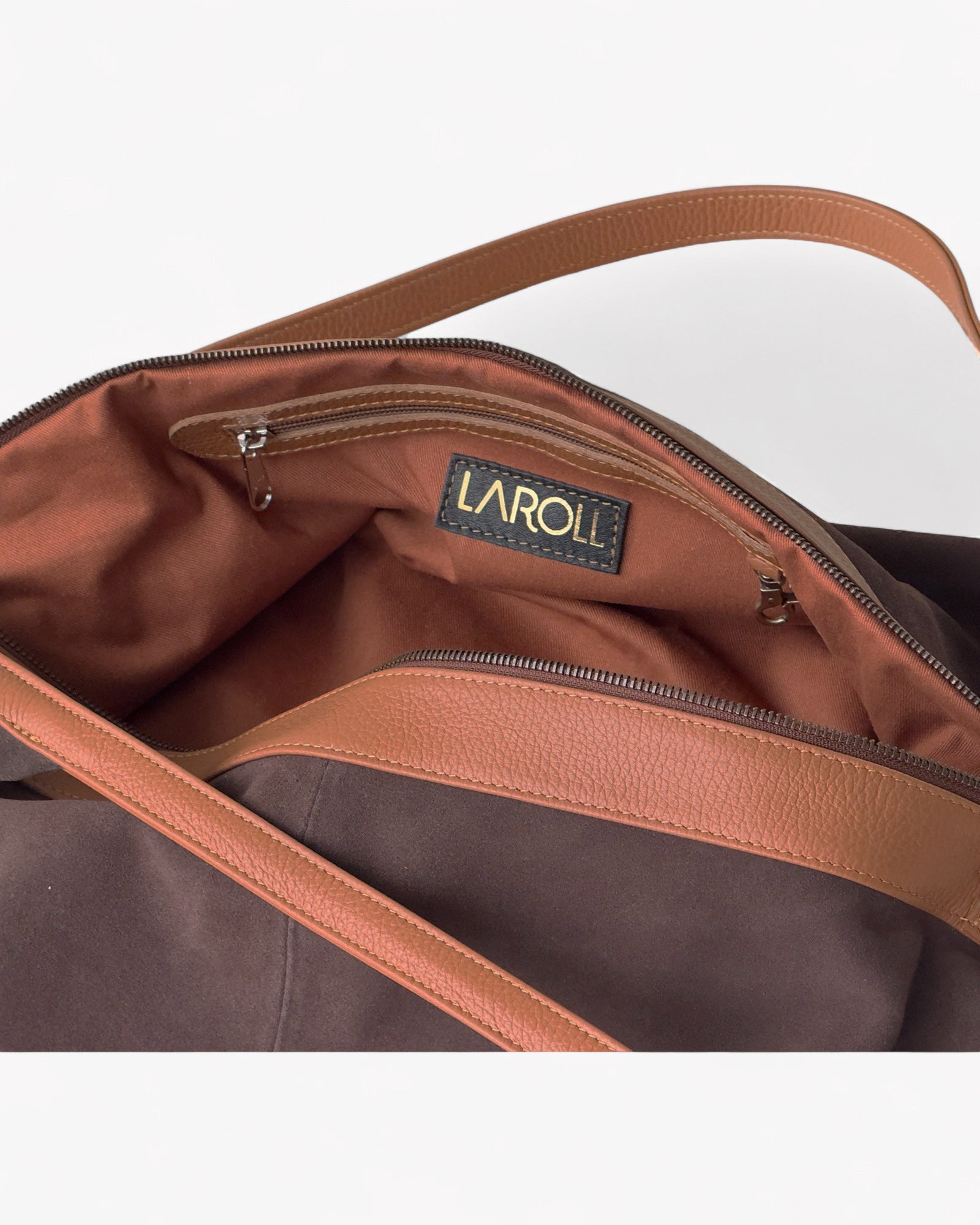 Brown leather bag with visible brand logo on a white background