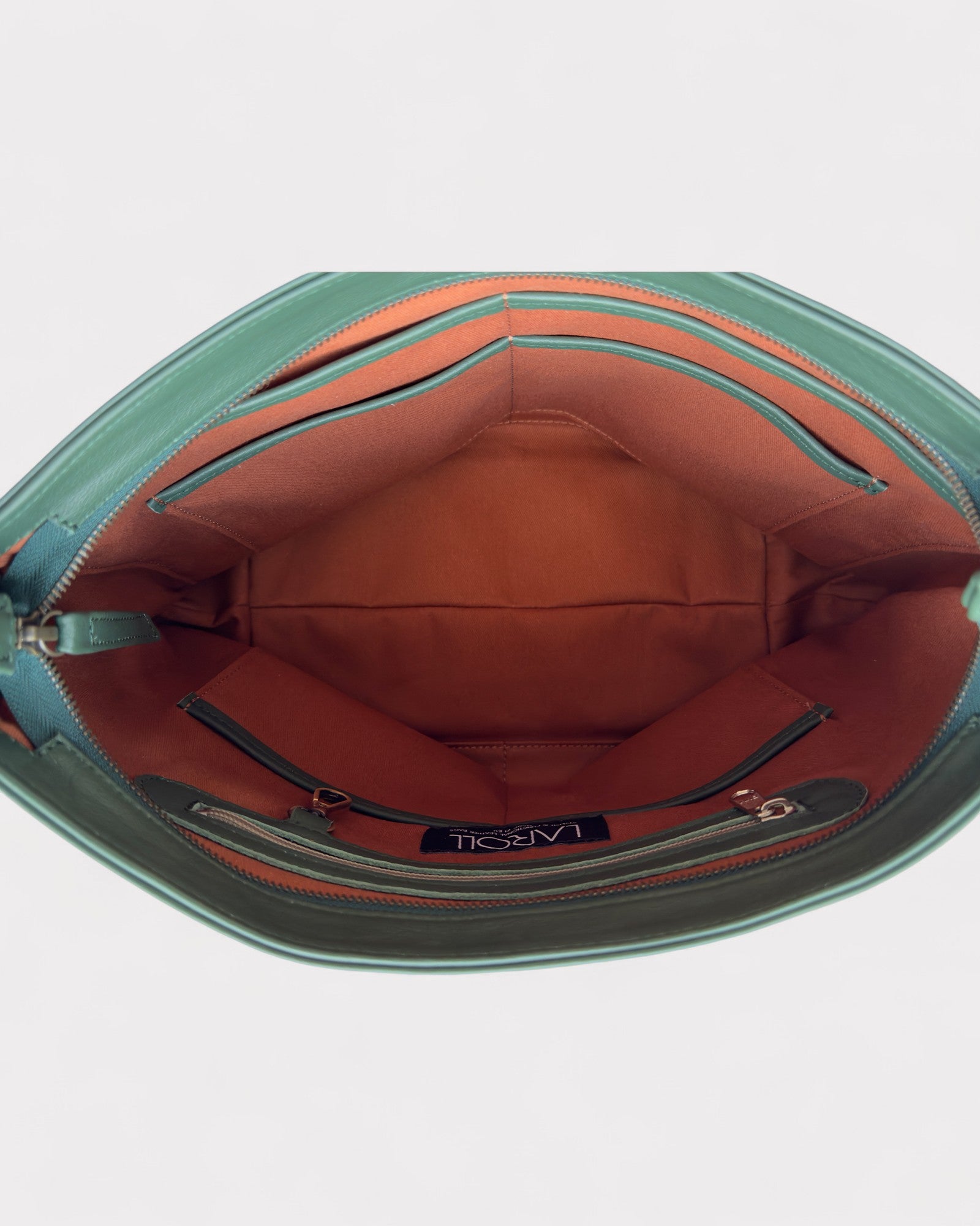 Open green handbag with red interior on a white background