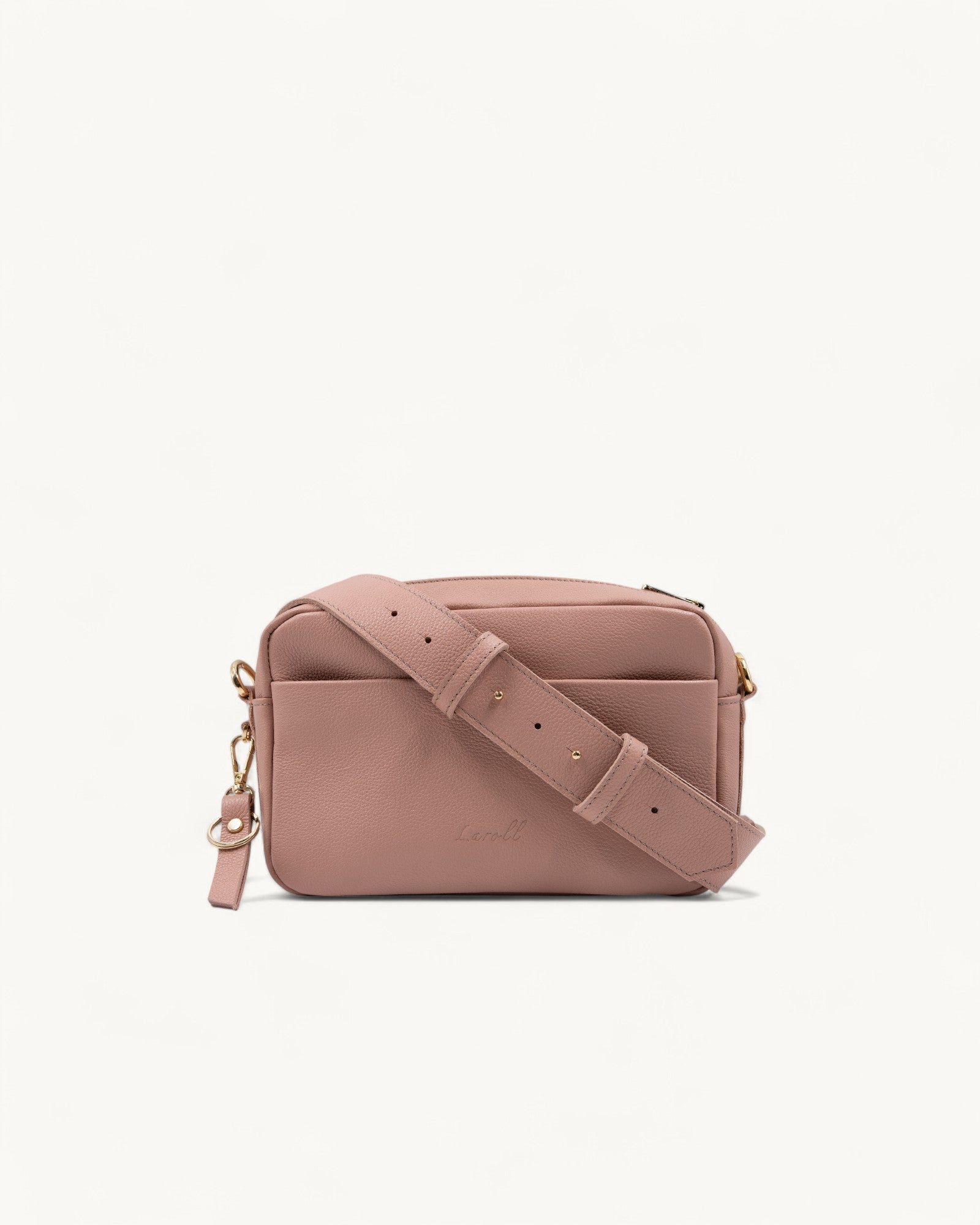 Pink handbag with a strap on a white background