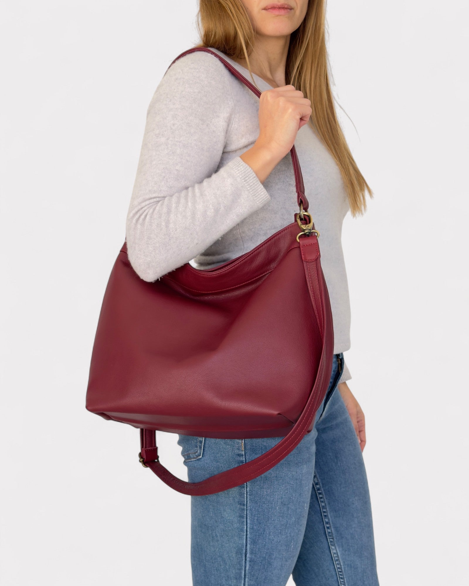 person wearing medium hobo bag red