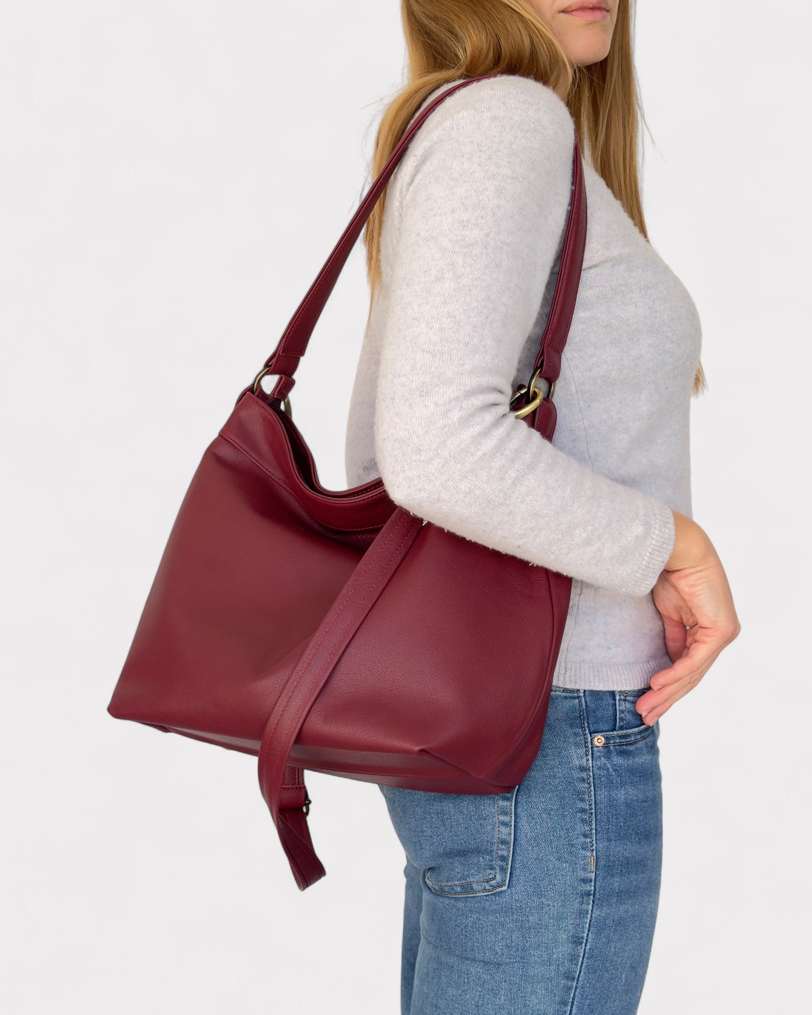 model carrying on shoulder medium red hobo bag