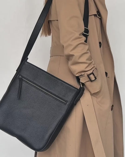 small video of black leather unisex crossbody bag