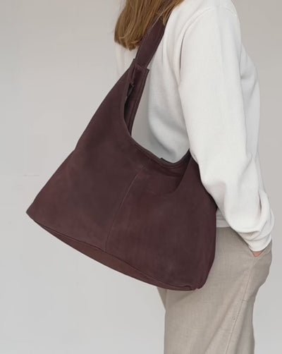 video of dark brown suede athina bag