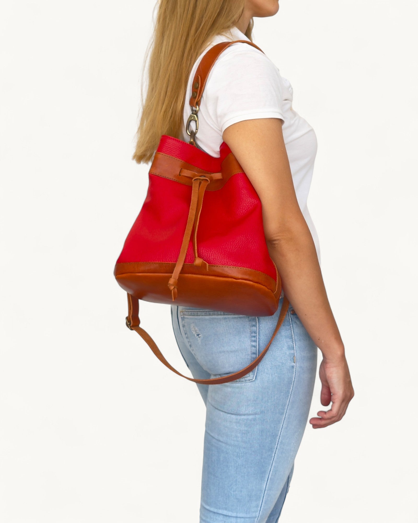 Person wearing a red and brown bucket on a white background